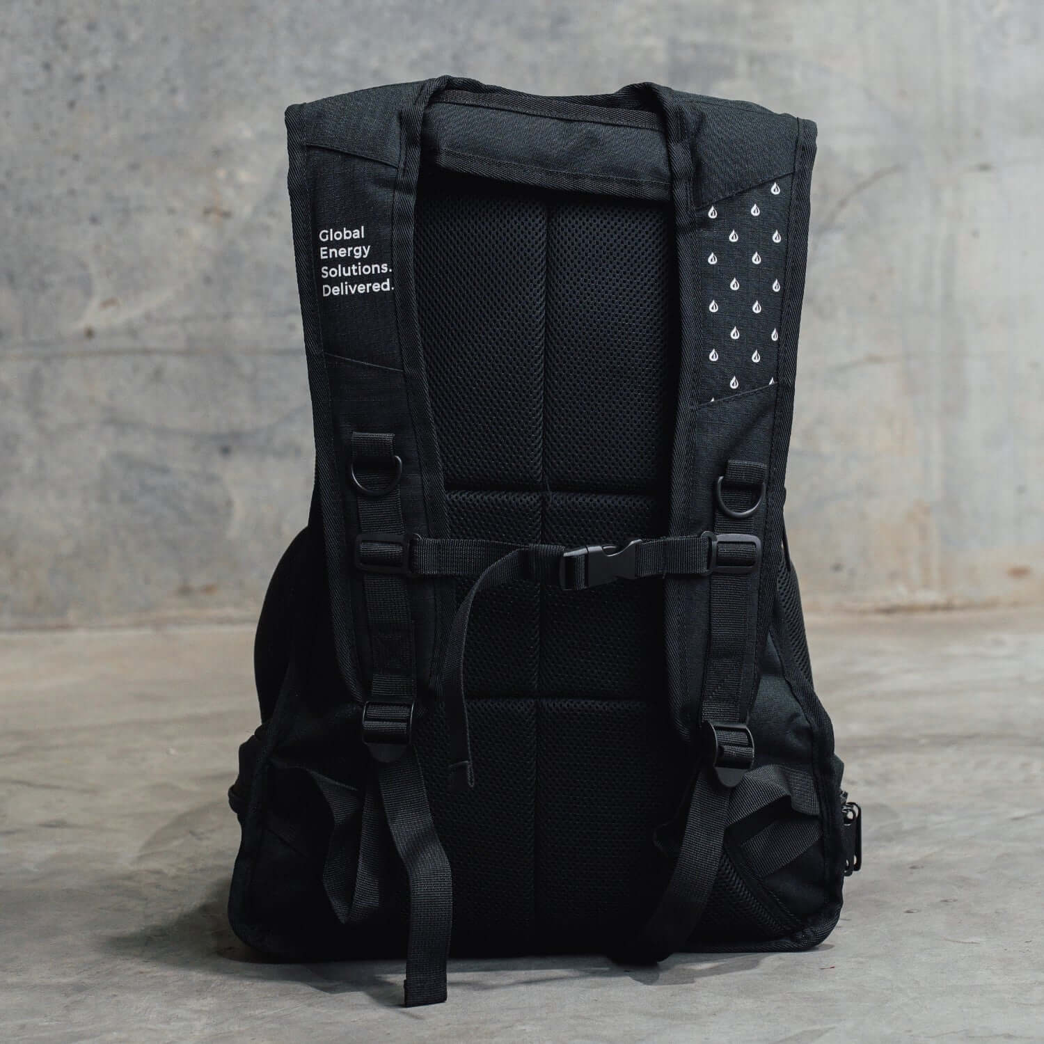 Black backpack with visible branding on a gray background